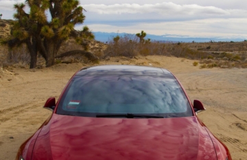 Tesla Model S with a Joshua Tree in Mojave, CA